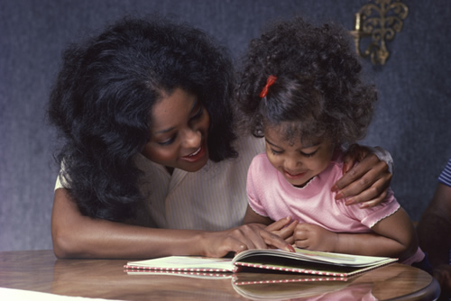 Parent and Child reading a book 